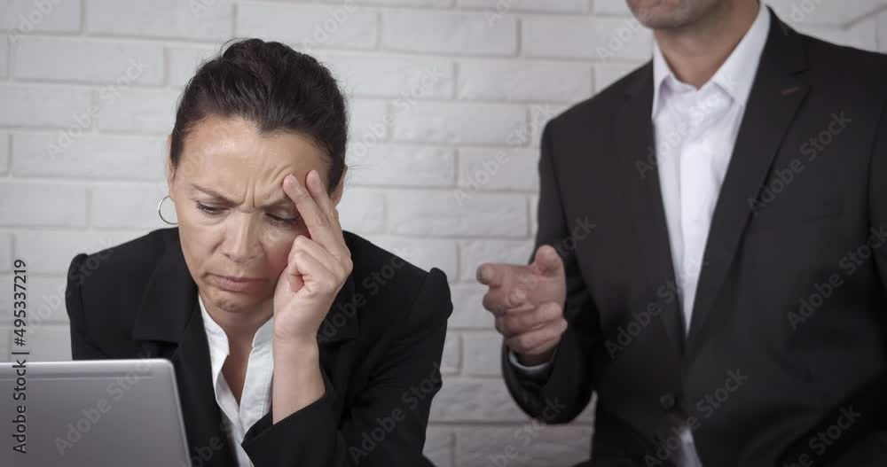 Angry boss with woman. An angry boss scream to his business woman partner in the office.