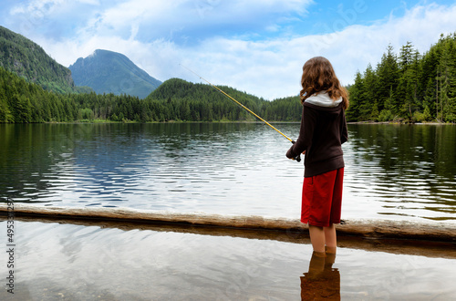 Young girl fishing in mountain lake © tab62