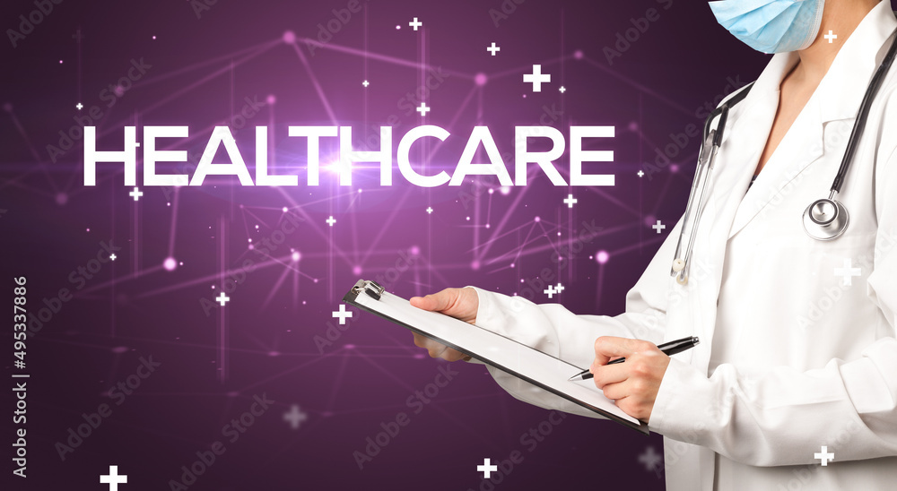Doctor fills out medical record Doctor fills out medical record