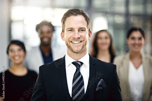 With a solid team, anything is possible. Cropped portrait of a group of businesspeople standing in the office.