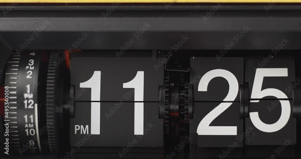 Retro Flip Clock Showing at 11:00 p.m.Spinning Timelapse 2 hours on black background. Retro Flip Clock Showing at 11:00 p.m.Spinning Timelapse 2 hours on black background.