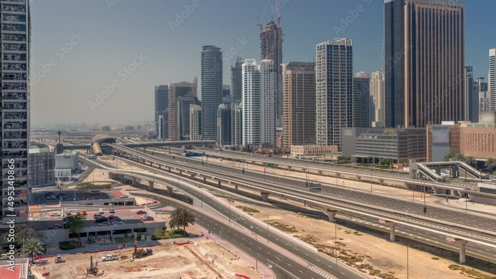 Dubai Marina skyscrapers and Sheikh Zayed road with metro railway aerial all day timelapse, United Arab Emirates Dubai Marina skyscrapers and Sheikh Zayed road with metro railway aerial all day timelapse, United Arab Emirates