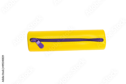 Yellow pencil case with purple zipper isolated on a white background. Flat lay.