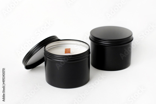 Soy candles in metal cans, handmade modern hobby , harmless coconut wax candles without paraffin on white background isolated