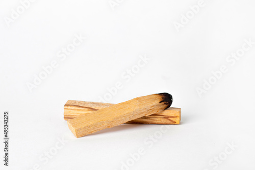 Palo Santo bars close-up and copy space. Ritual cleansing with sacred ibiocai, meditation, aromatherapy with incense and candles.