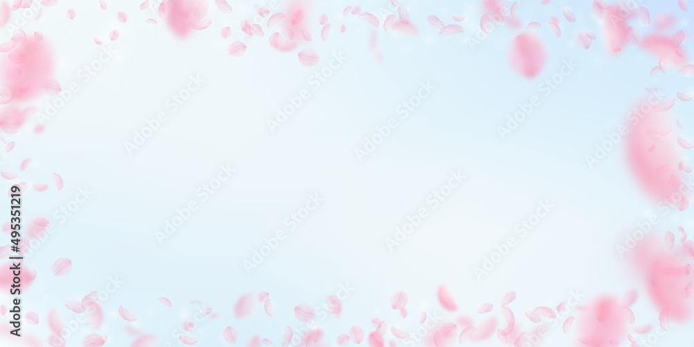 Sakura petals falling down. Romantic pink flowers frame. Flying petals on blue sky wide background. Love, romance concept. Magnetic wedding invitation.