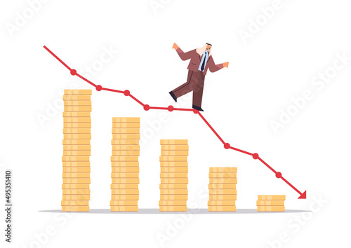 arab businessman standing on downward red arrow recession financial crisis bankruptcy
