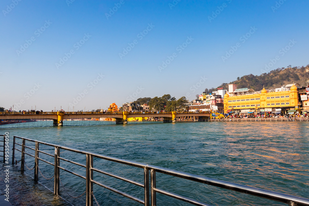 city view at the shore of flowing river at morning from flat angle