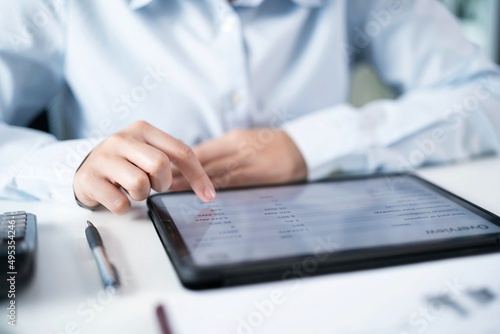 Business woman hand presses on screen digital tablet Online Digital marketing   technology