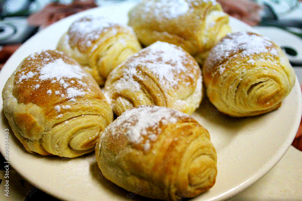 sweet bun, muffin on a plate cooked at home sweet bun, muffin on a plate cooked at home