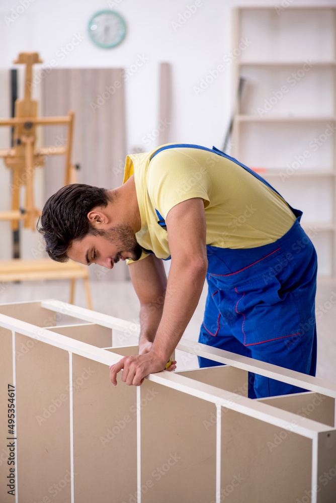 Young male carpenter working at home Young male carpenter working at home