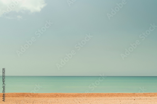 Beach blue ocean and sky background  summer concept . Blurred image of sea and blue sky background with clouds. Nature back  idea banner for holiday or weekend