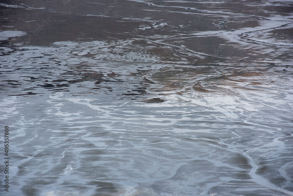 Muddy waters in a decantation pond. Toxic residuals from a copper mine decating in a settling basin Muddy waters in a decantation pond. Toxic residuals from a copper mine decating in a settling basin