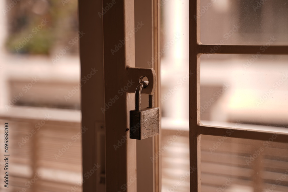 A silver metal on a metal gate lock A silver metal on a metal gate lock