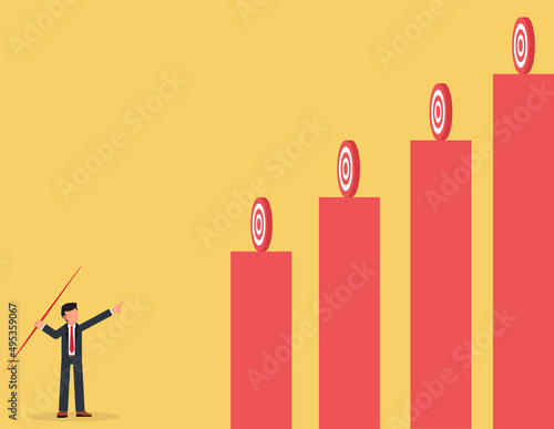 Goals and challenges.businessman holding a spear aiming at targets of different heights.