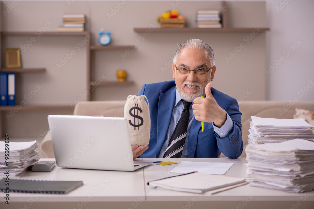 Old male boss working from home in remuneration concept Old male boss working from home in remuneration concept