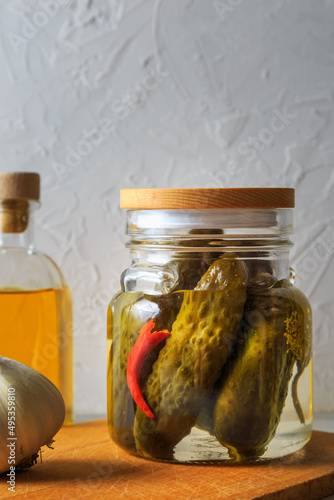 Pickled cucumbers in a jar.