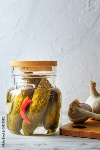 Pickled cucumbers in a jar.