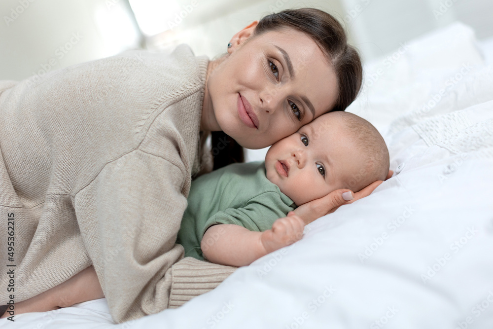 A woman with a small child. Mom with a baby. High quality photo A woman with a small child. Mom with a baby. High quality photo
