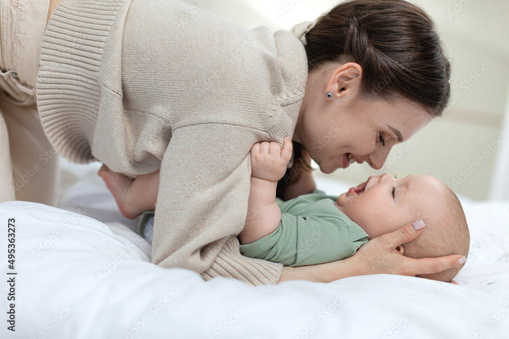 A woman with a small child. Mom with a baby. High quality photo A woman with a small child. Mom with a baby. High quality photo