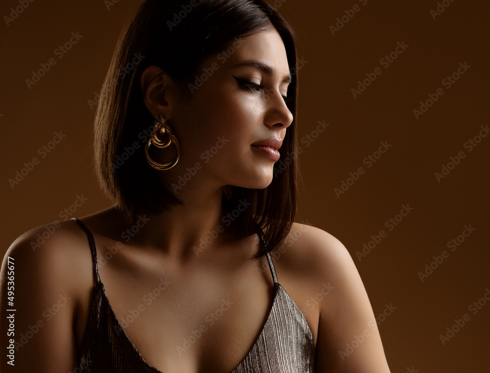 Sexy Woman Face Portrait over Dark. Luxury Beauty Model with Gold