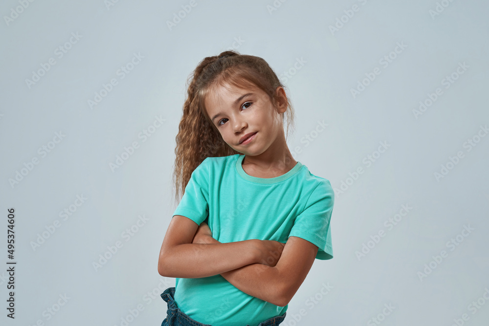 Cropped of confident little girl with crossed arm Cropped of confident little girl with crossed arm