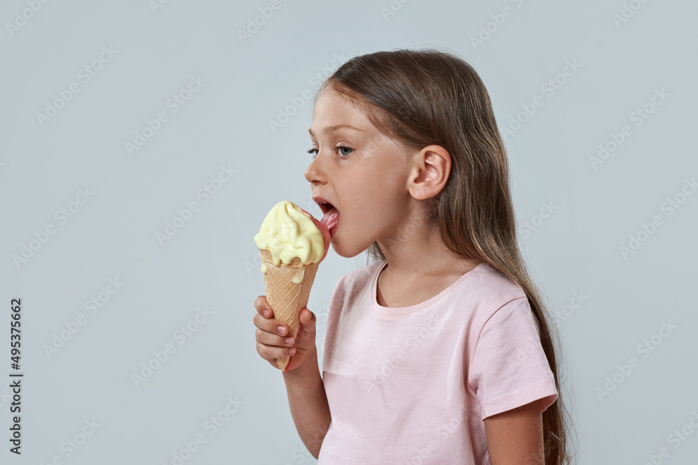 Little girl licking sweet delicious ice cream cone Stock Photo | Adobe ...