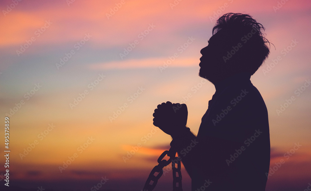 Silhouette man with chain Freedom, Worship and Pray.Repent of wrong doing.Prisoner with break chain power of prayer sunset background.Pray faith hope.Forgive revival.Sacrifice and Mercy.Man repent sin - obrazy, fototapety, plakaty 