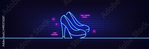 Neon light glow effect. Women shoes line icon. Female footwear sign. Fashion high heels symbol. 3d line neon glow icon. Brick wall banner. Shoes outline. Vector