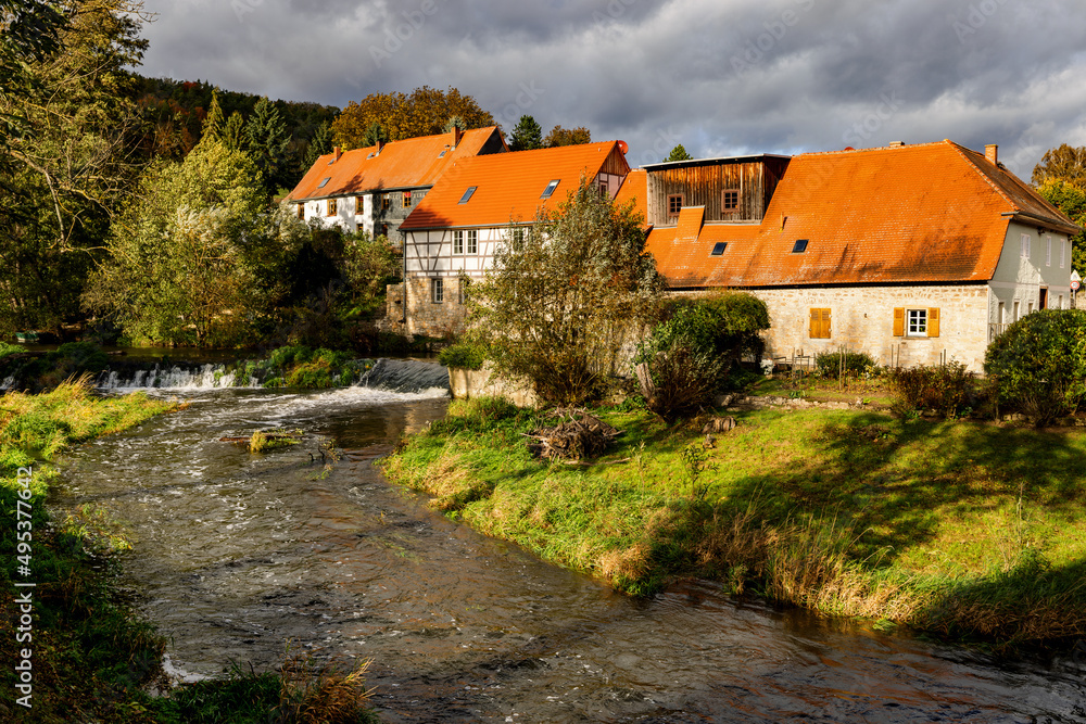 Historic water mill at the river Ilm in Buchfart, Thuringia, Germany.