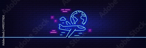 Neon light glow effect. Global travel line icon. International flight sign. Online trip symbol. 3d line neon glow icon. Brick wall banner. International flight outline. Vector