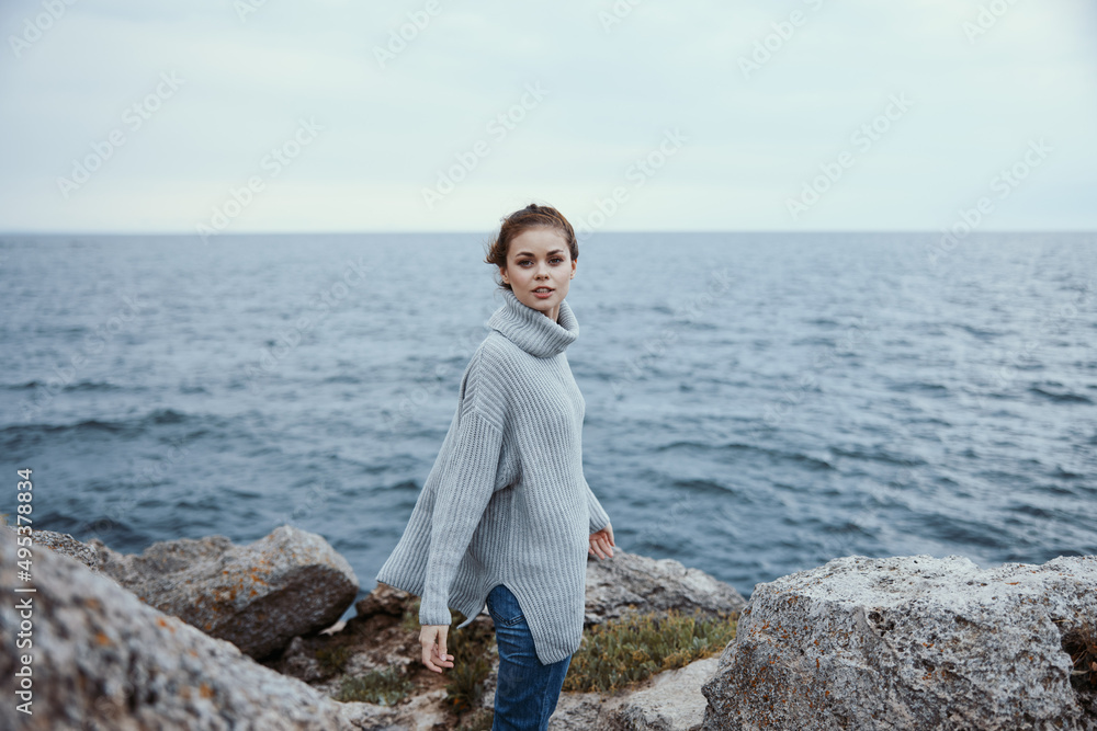 portrait of a woman sweaters cloudy sea admiring nature Lifestyle portrait of a woman sweaters cloudy sea admiring nature Lifestyle