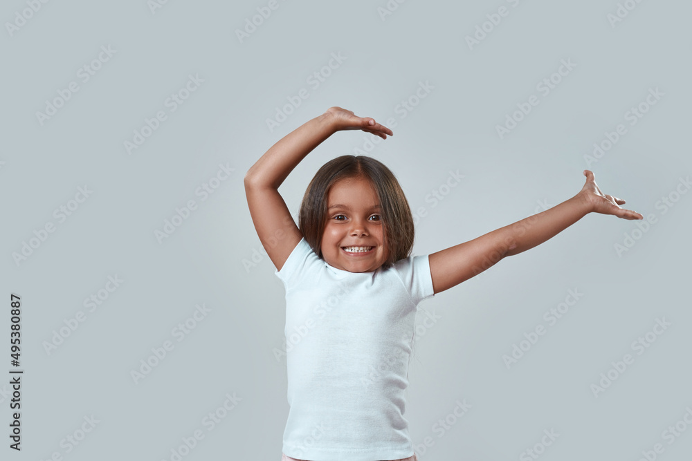 Partial of cheerful girl dancing with hands in air Partial of cheerful girl dancing with hands in air