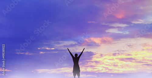 Success achievement concept.. Silhouette of a happy person in the sky.