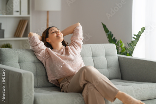 woman resting on a sofa photo