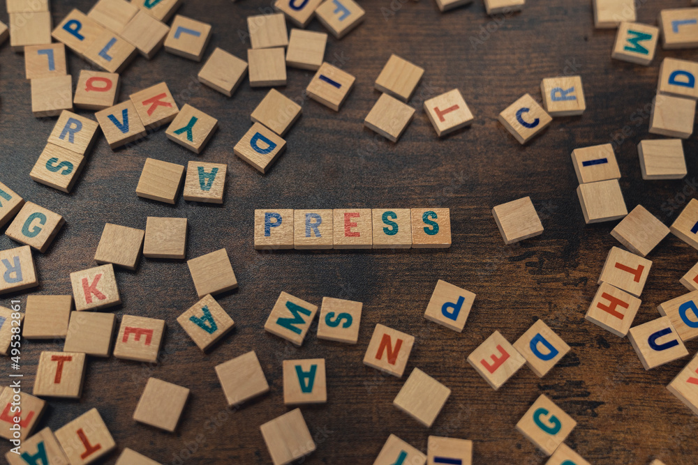 PRESS - composed of wooden alphabet letters the media, journalism concept . High quality photo