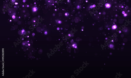 Colorful purple bokeh effect. Sparkling magical dust particles. Magic concept.