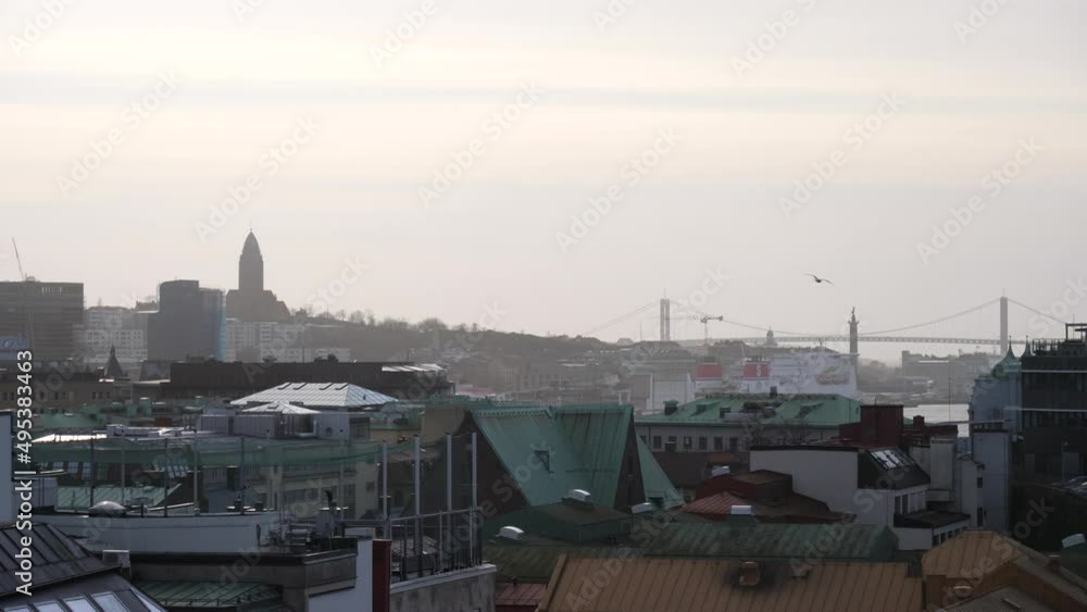 Seagull Flying over Gothenburg Cityscape with Alvsborg Bridge Background, Establishing shot Seagull Flying over Gothenburg Cityscape with Alvsborg Bridge Background, Establishing shot