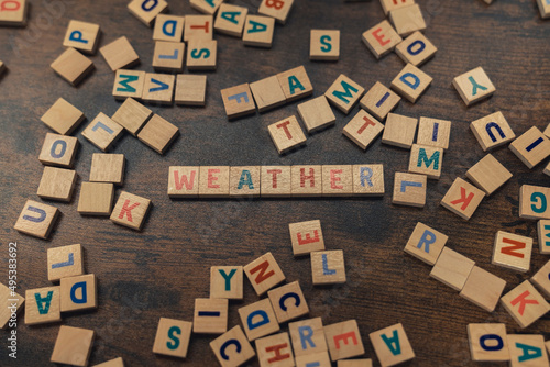 A word WEATHER made of aligned wooden alphabet letters climate concept . High quality photo