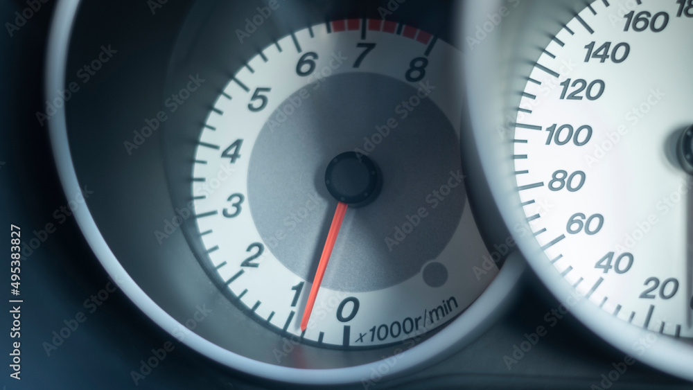 Close up of car dashboard tachometer on blackground Close up of car dashboard tachometer on blackground
