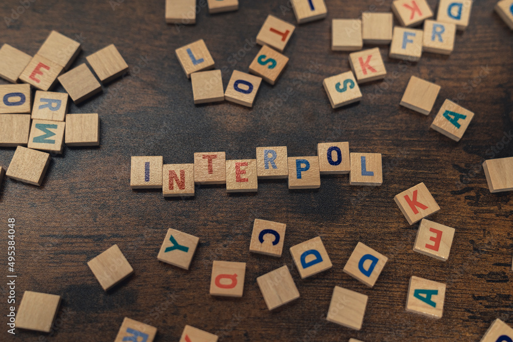 A word INTERPOL made of wooden alphabet letters safety concept . High quality photo A word INTERPOL made of wooden alphabet letters safety concept . High quality photo