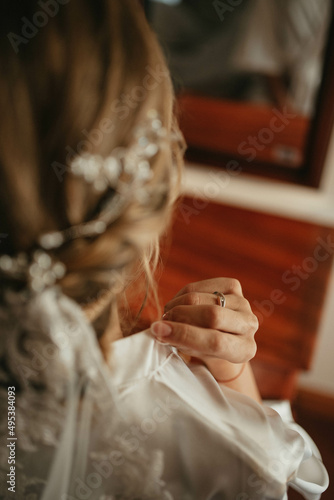 Last preparations for wedding ceremony stock photo. Team bride.