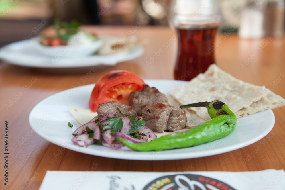 grilled meat served with vegetables