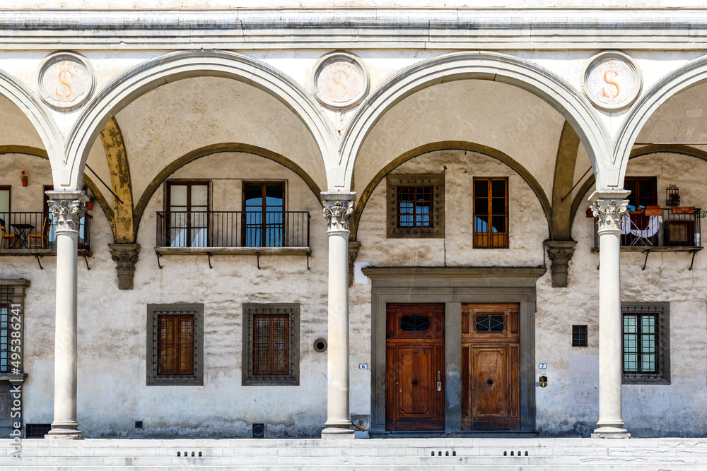 Obraz premium Building with arches along the Piazza della Santissima Annunziata square in Florence, Tuscany, Italy, Europe