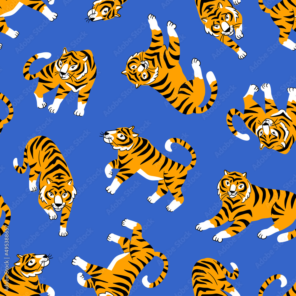 Fototapeta premium Vector seamless pattern with cute tigers on the blue background. Circus animal show. Fashionable fabric design.