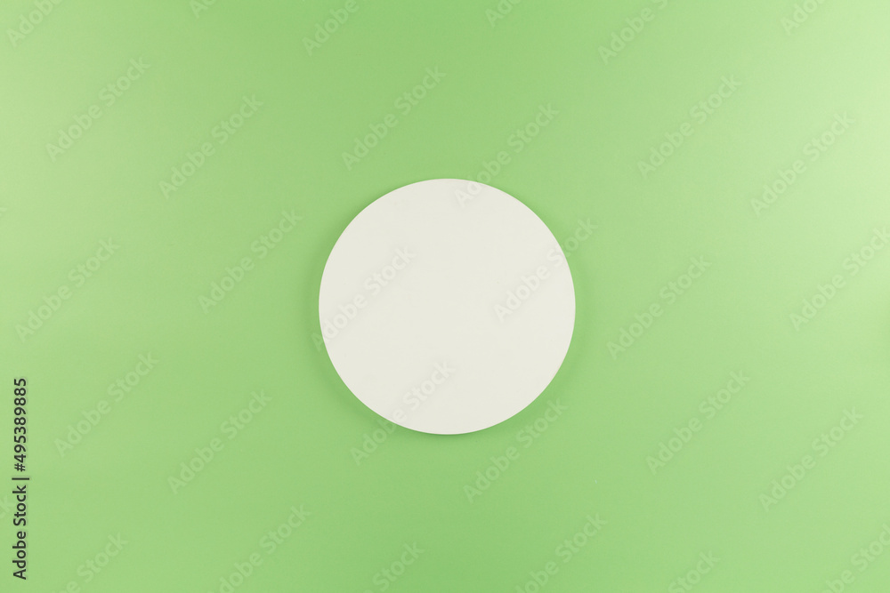 white round circle on green background white round circle on green background
