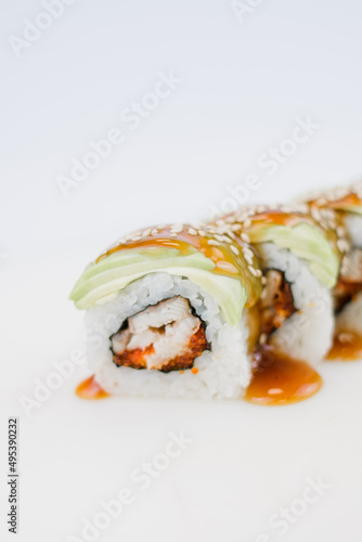 Japanese cuisine roll with avocado and sesame seeds