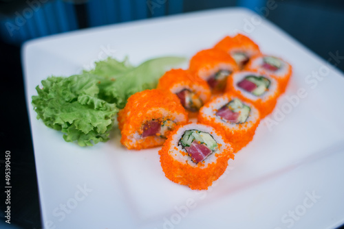 Japanese roll with tuna and white rice in tobiko caviar