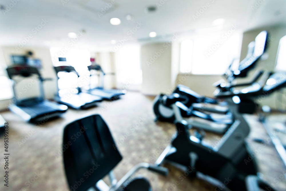 Abstract blur of sport equipment in gym interior for background