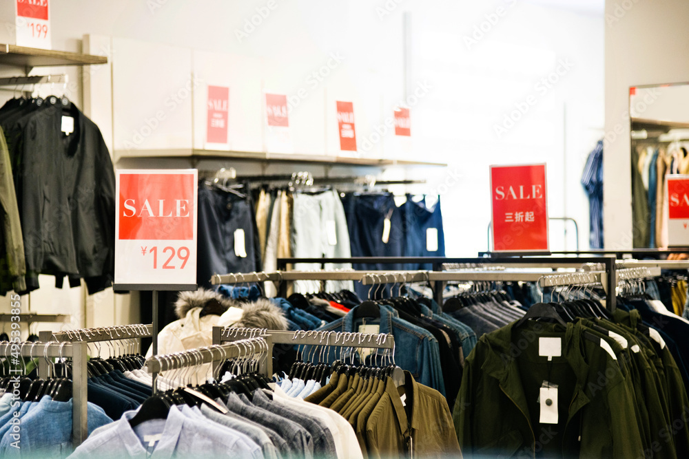 Shopping sale sign in a clothing store Shopping sale sign in a clothing store